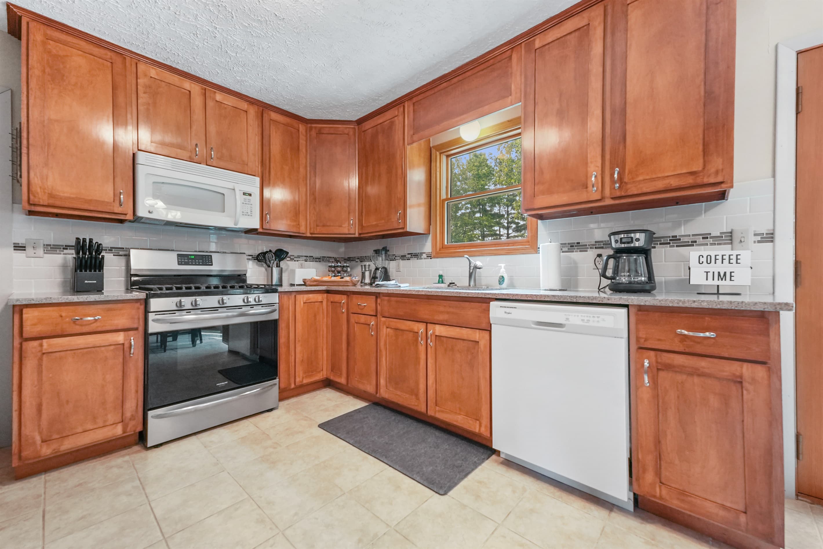 Kitchen: Cook up new memories in this bright space with modern appliances and charming decor!