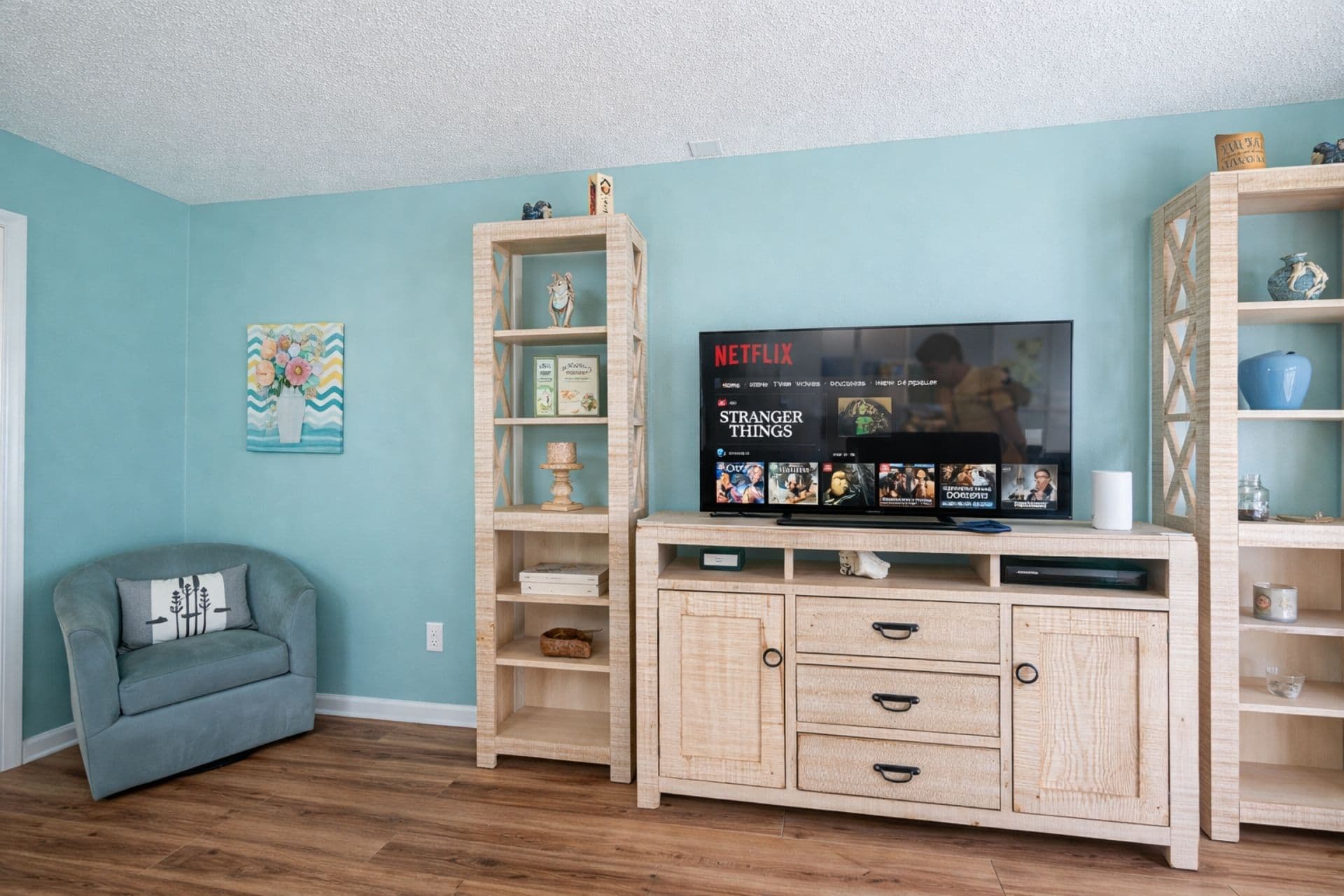Living Room: Bright hues and comfy seating perfect for lounging after beach adventures!