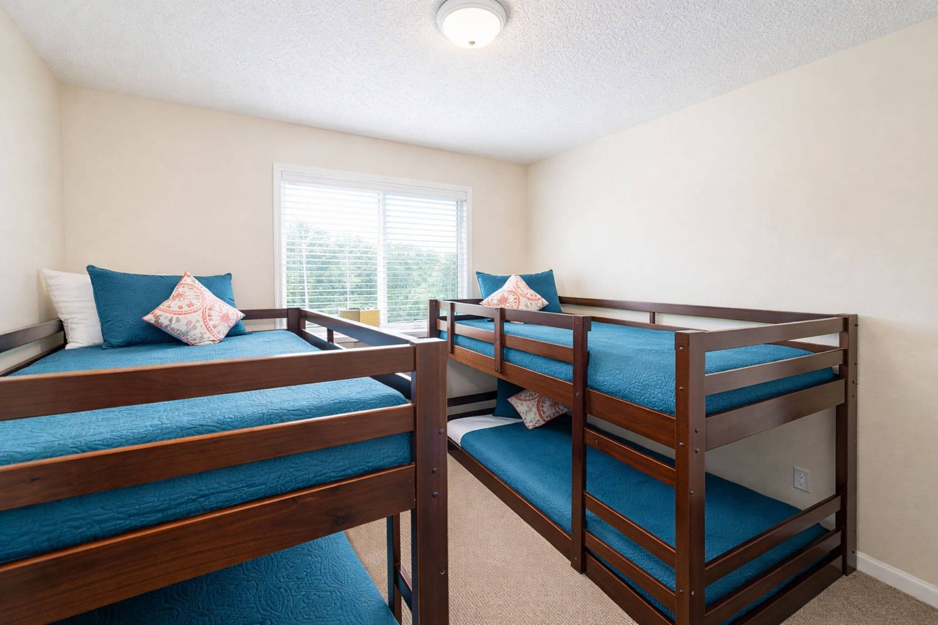 Bunk Room: Vibrant art and sunny vibes await in this playful bunk room for unforgettable adventures!