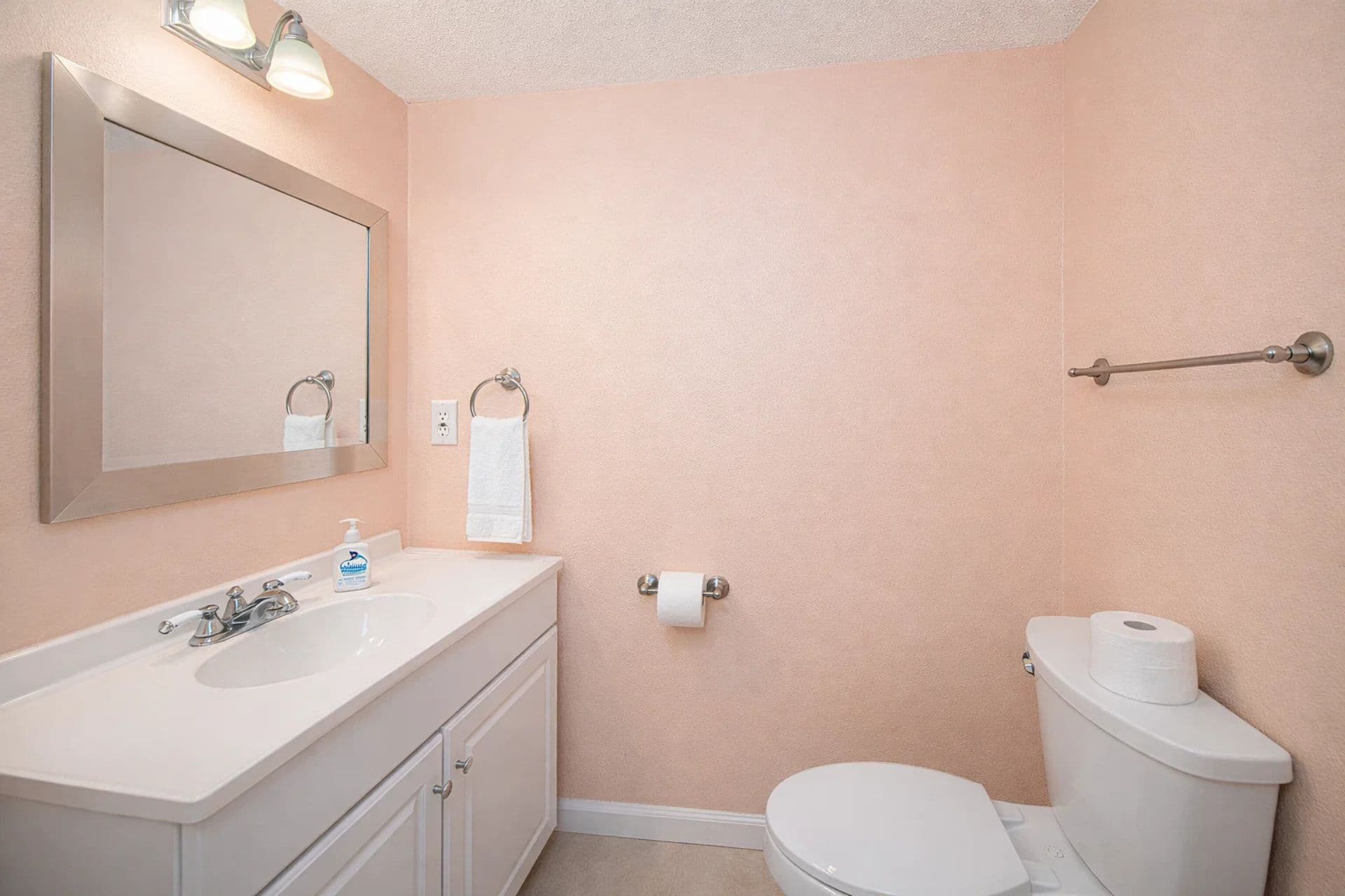Half bathroom downstairsHalf Bathroom: Bright, cheerful vibes await! Freshen up with style in this vibrant space!