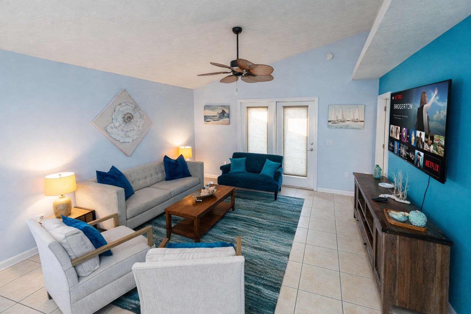 Living Room: Vibrant colors and beach vibes, perfect for relaxation and movie nights!
