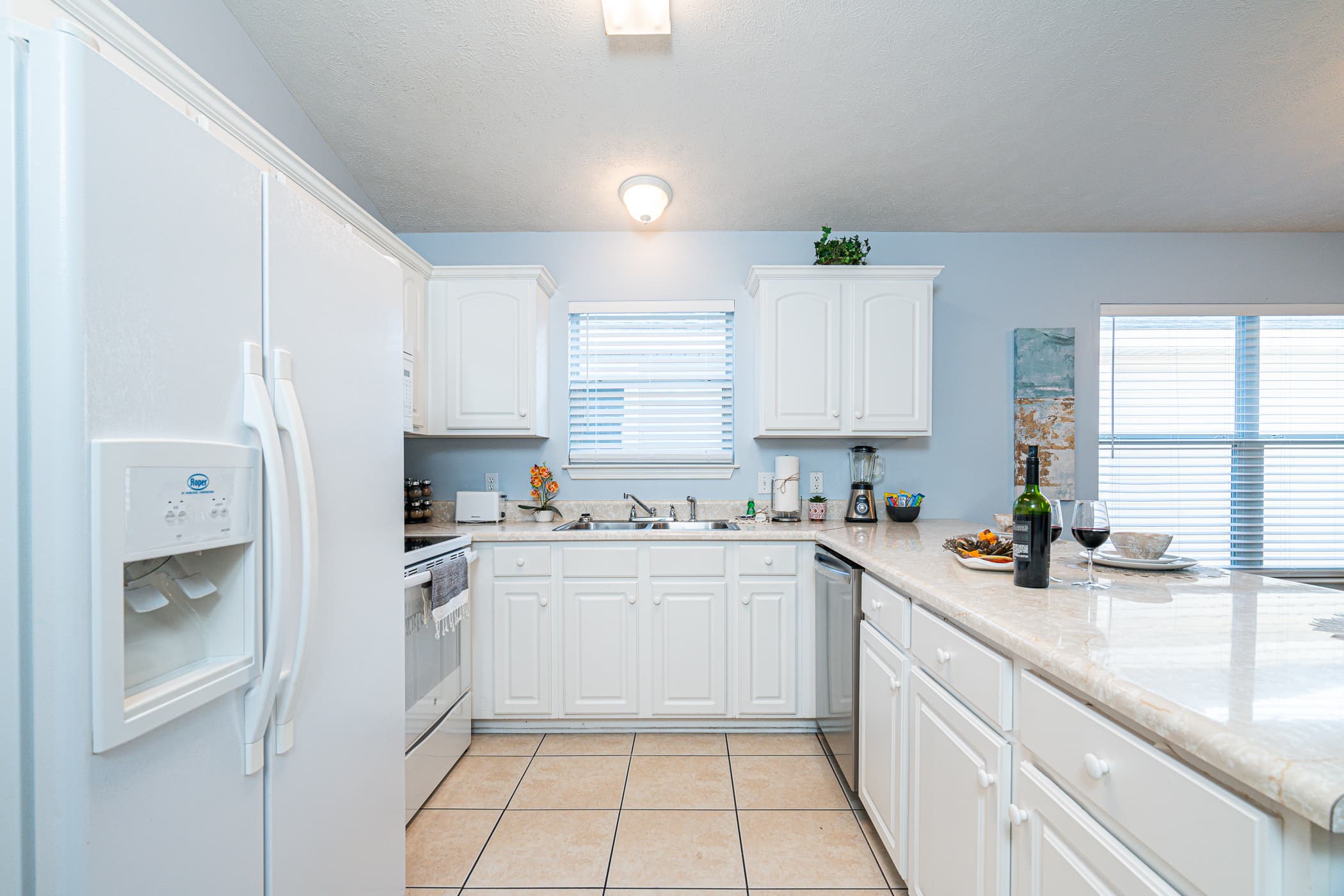 Vibrant Kitchen: Enjoy meals under a colorful glow with modern decor and spacious dining options!
