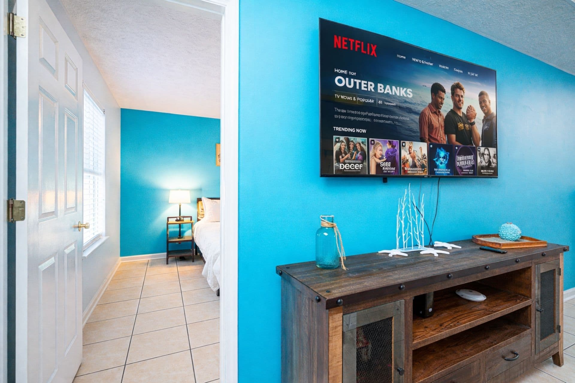 Living Room: Vibrant colors and beach vibes, perfect for relaxation and movie nights!