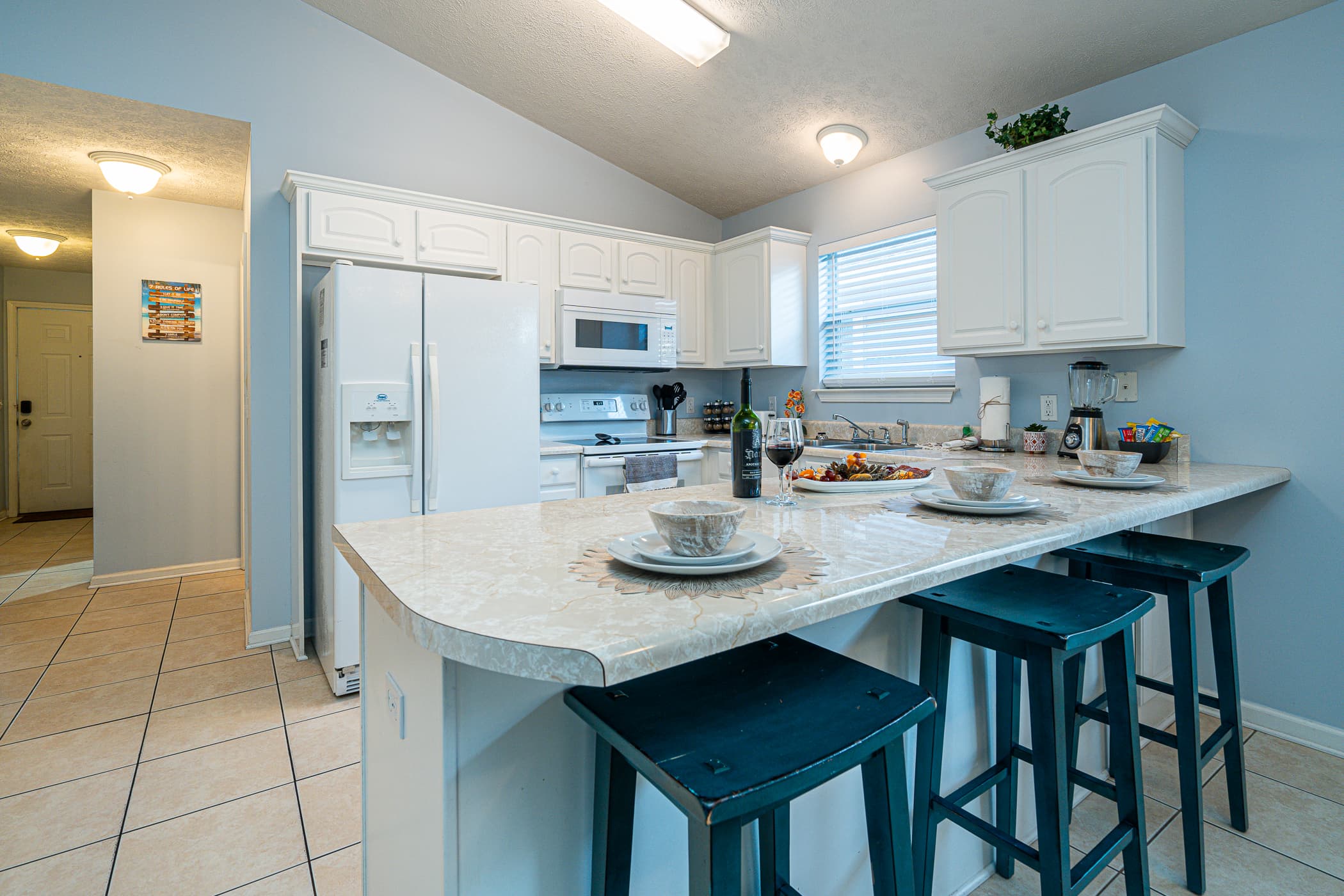 Vibrant Kitchen: Enjoy meals under a colorful glow with modern decor and spacious dining options!
