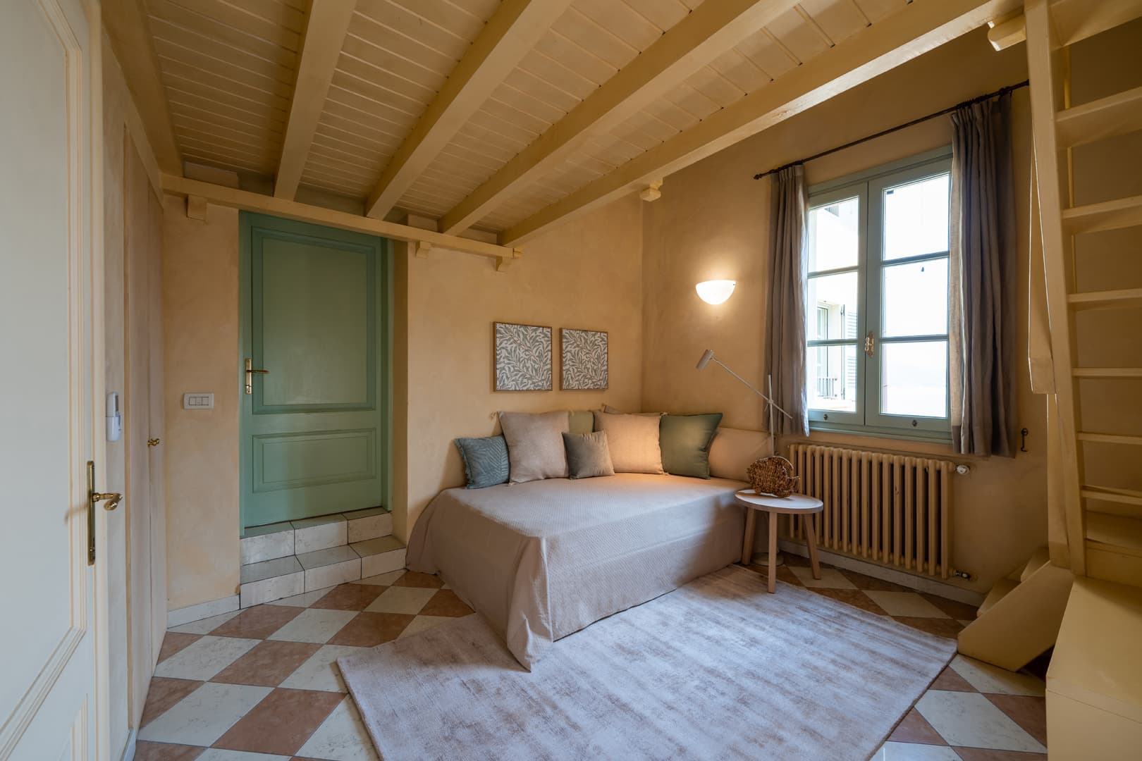 Junior loft with queen-size bed, en-suite bathroom, and children's bed