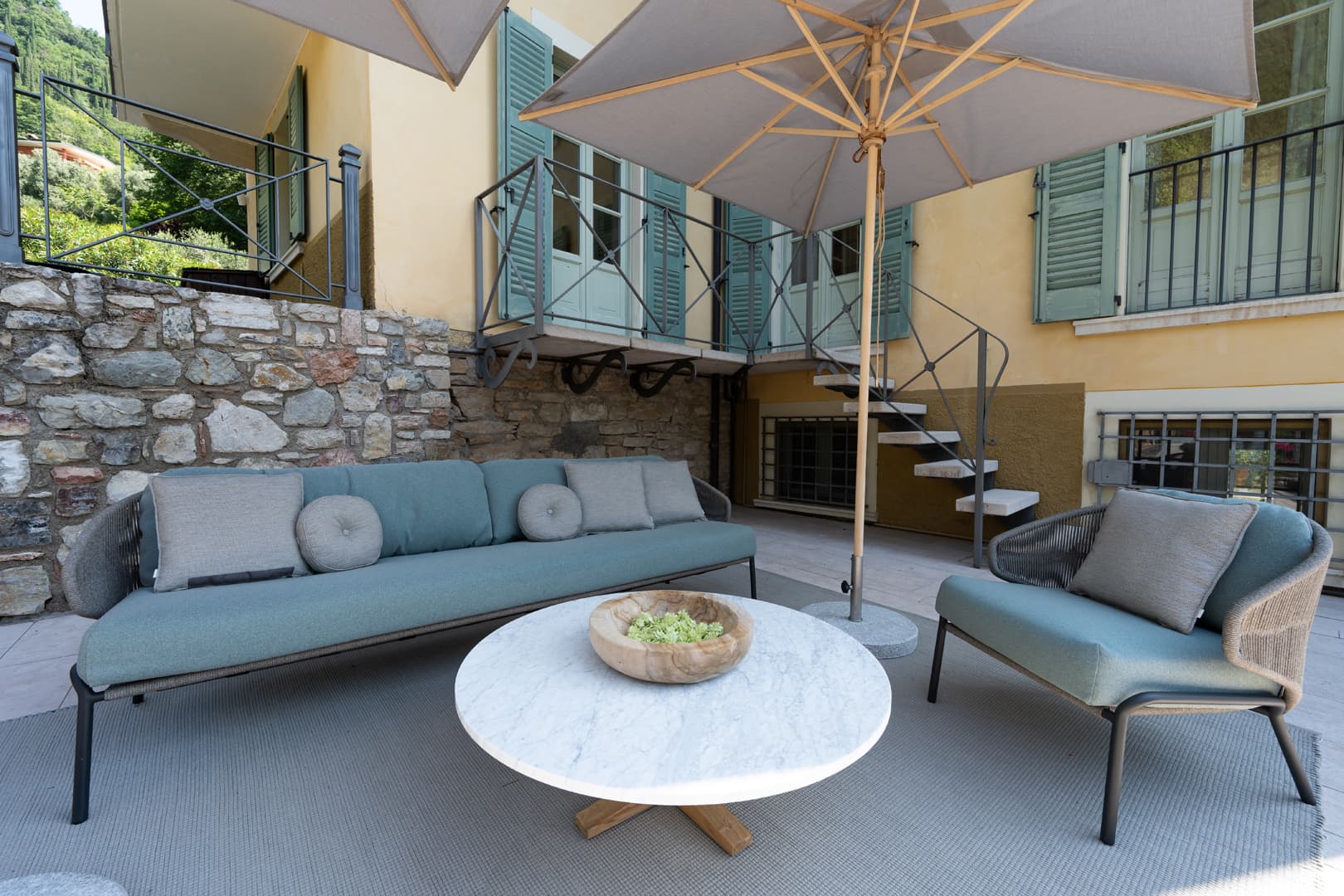 An outdoor area of the superior villa with relaxation spaces