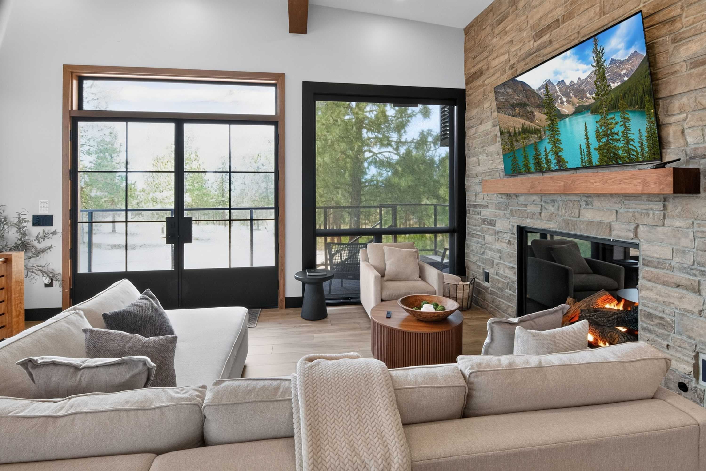 Living room with 85 inch tv and huge gas fireplace
