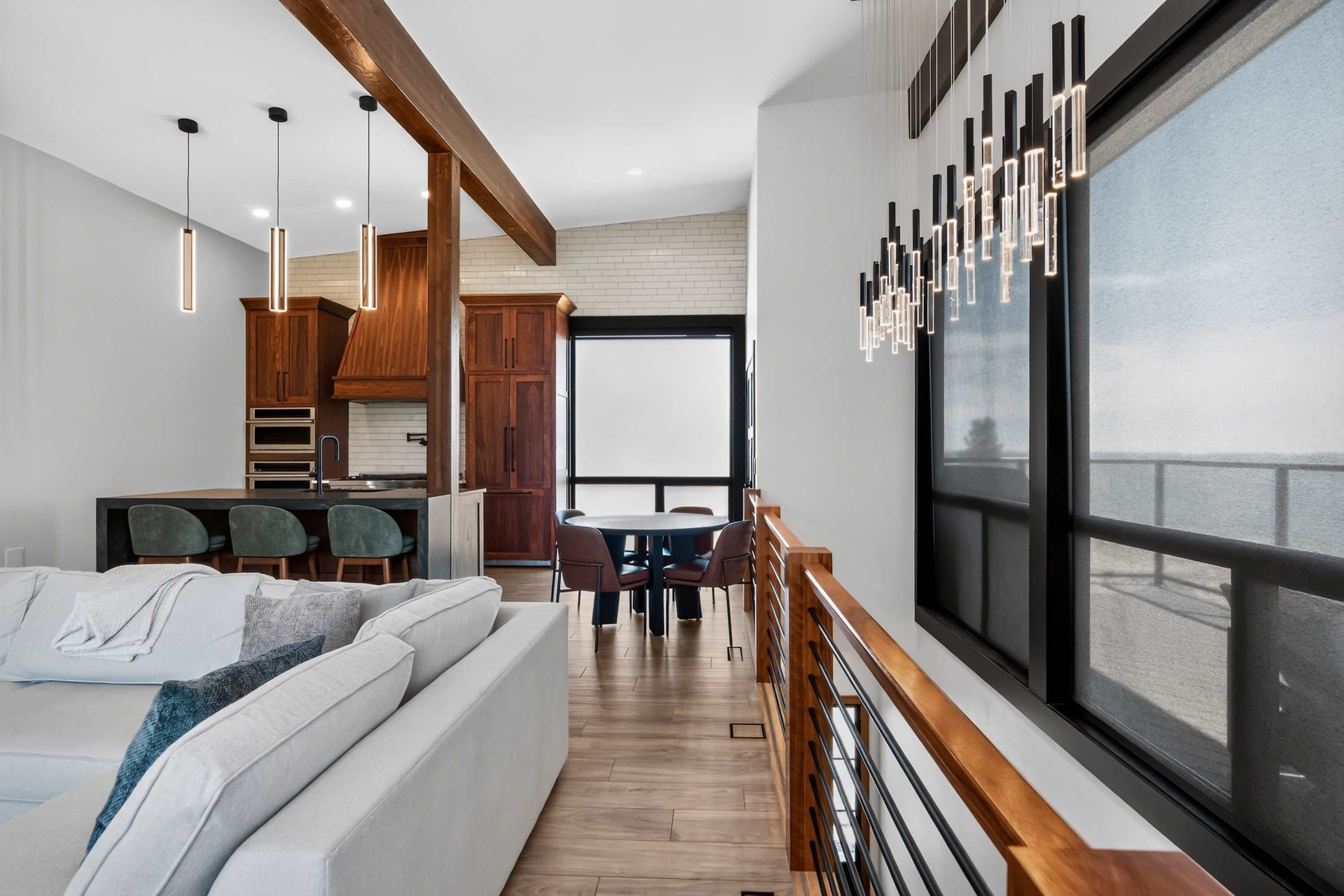 Stairs, living room, dining area, wood accents