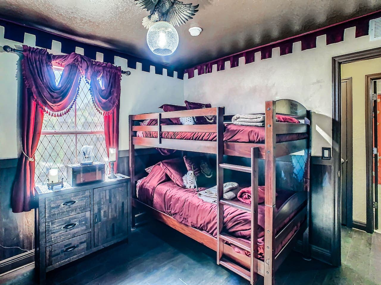 Inside the Gryffindor bedroom, for our young guests, there are Harry Potter toys to play with, books to read, their own large Television, even a snitch nightlight! It really can't get any better. Two twin bunk beds sleep 4 in this room.