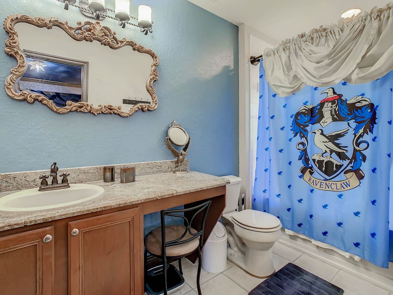 Private Ravenclaw master bedroom with a jetted tub and shower combo.