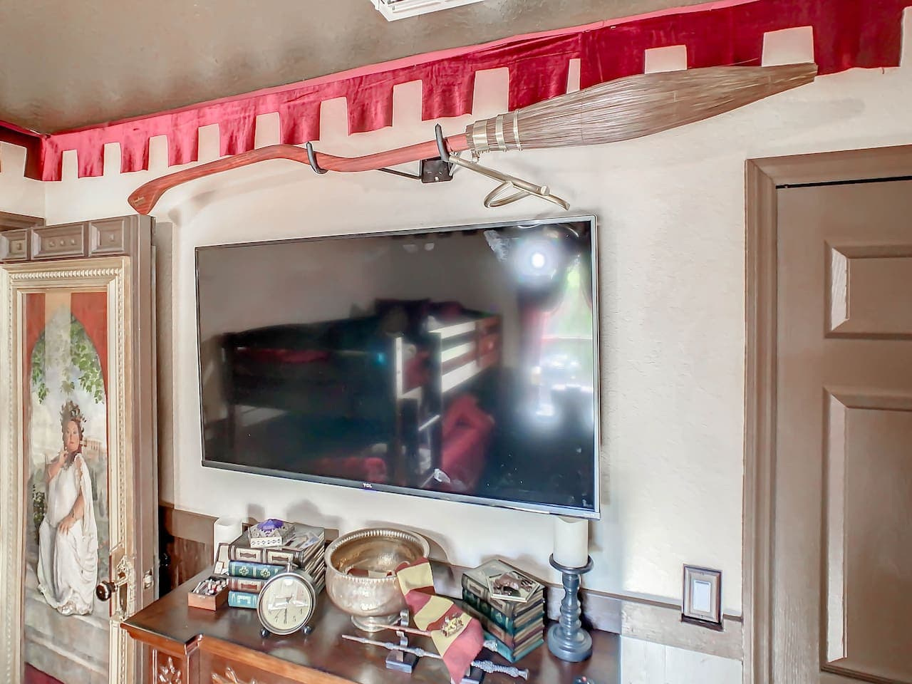 The Nimbus 2000 is positioned just over the TV for all quidditch fans.