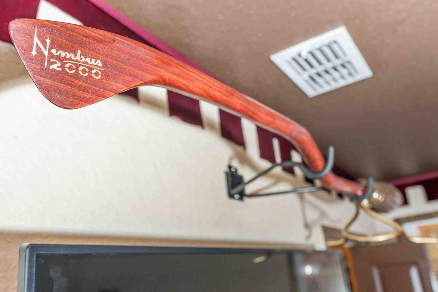 The Nimbus 2000 can be found above the Gryffindor bedroom TV.