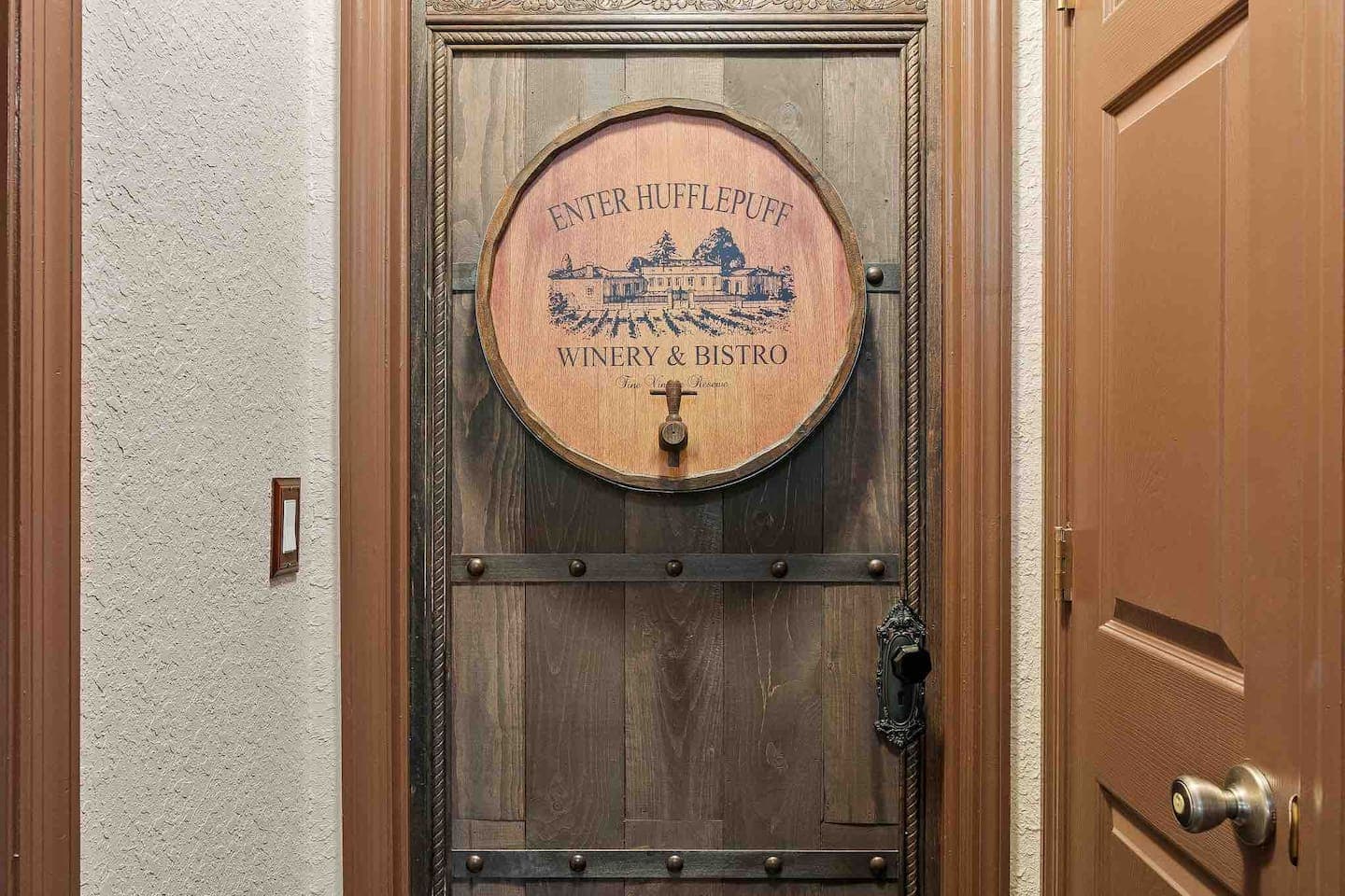 In the books (never mentioned in the movies) Hufflepuff enters a barrel near the kitchen. Welcome, Hufflepuffs.