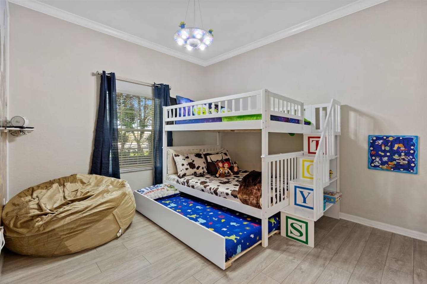 The bunk bed sleeps 5, with a full over full and twin trundle 