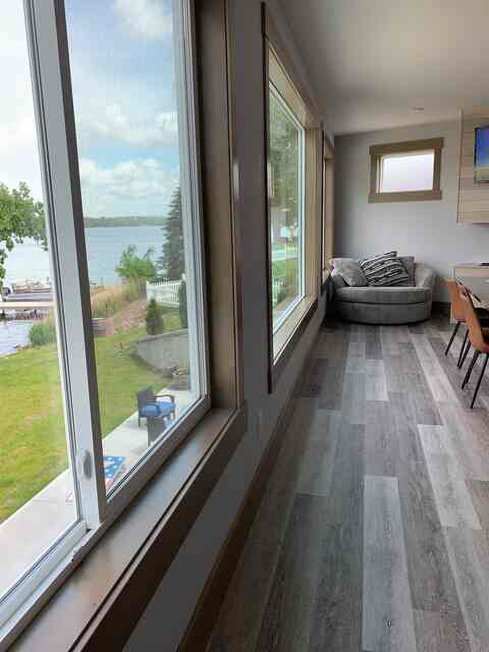 Dining room overlooking walkout and lake.