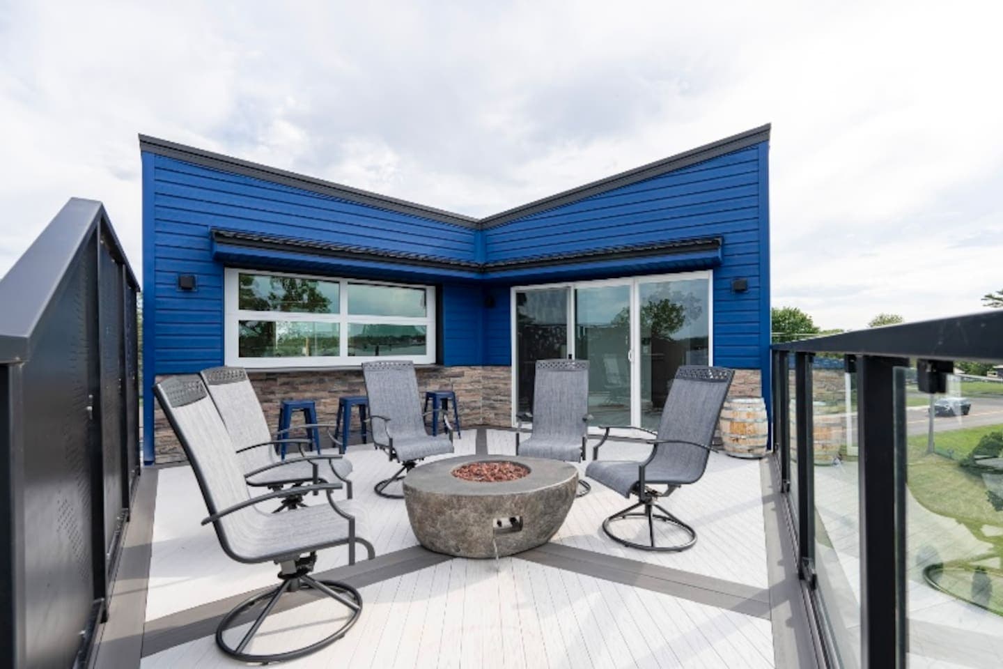 Great gathering space with a beautiful view and gas fire to enjoy in the Spring, Summer, and Fall. The chairs are put away for the winter season.