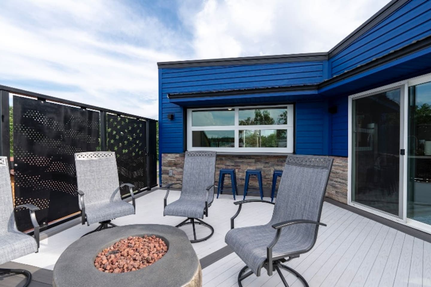 Great gathering space with a beautiful view and gas fire to enjoy in the Spring, Summer, and Fall. The chairs are put away for the winter season.