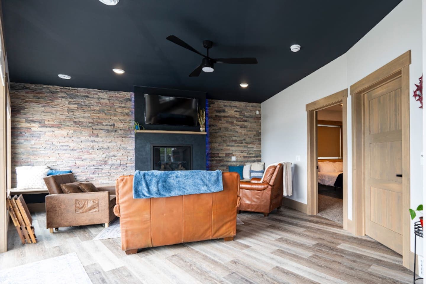 Living room with fireplace and TV.