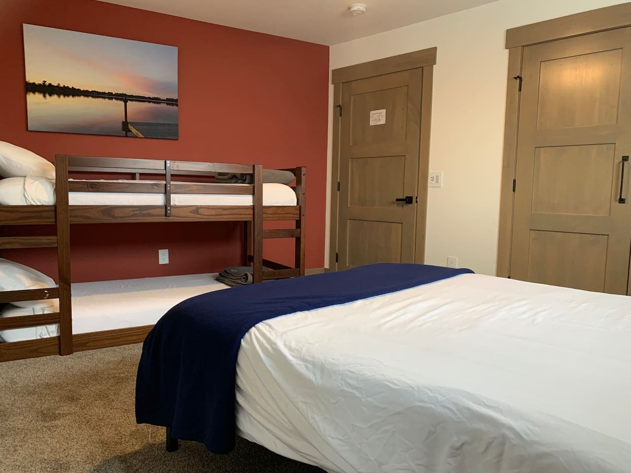 Bedroom 2 (Red Room) with bunk beds and plenty of closet storage space.