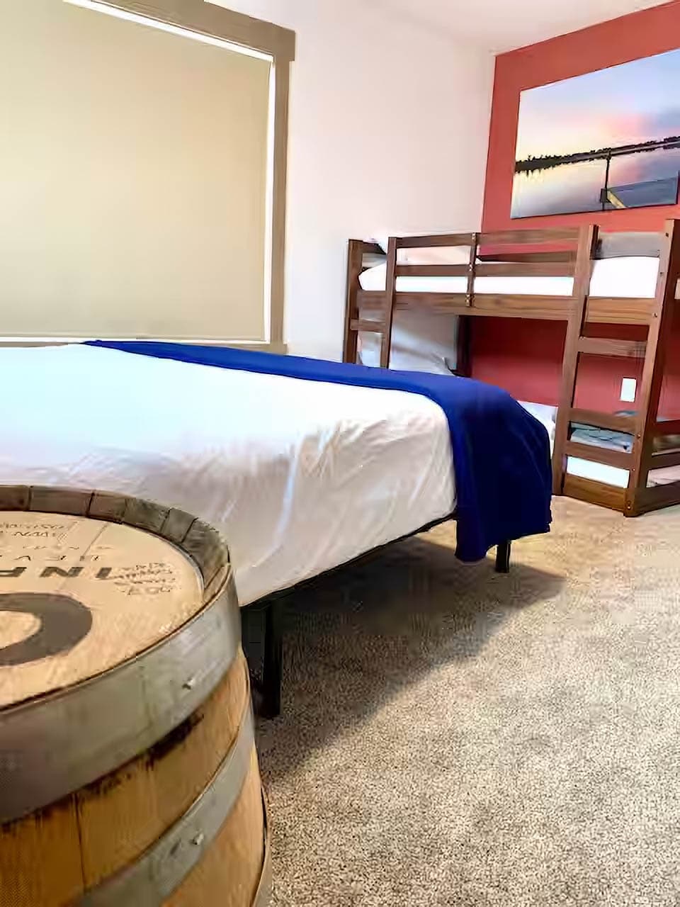 Bedroom 2 (Red Room) with queen bed plus bunkbeds and plenty of closet storage space.