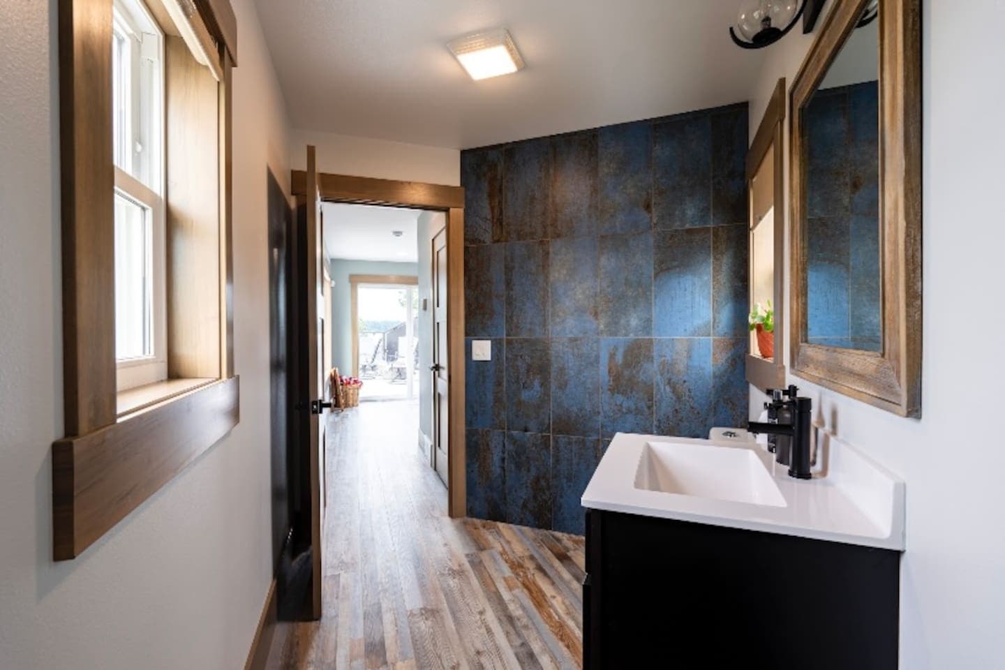 Bathroom 4 off the rooftop game room space is spacious.