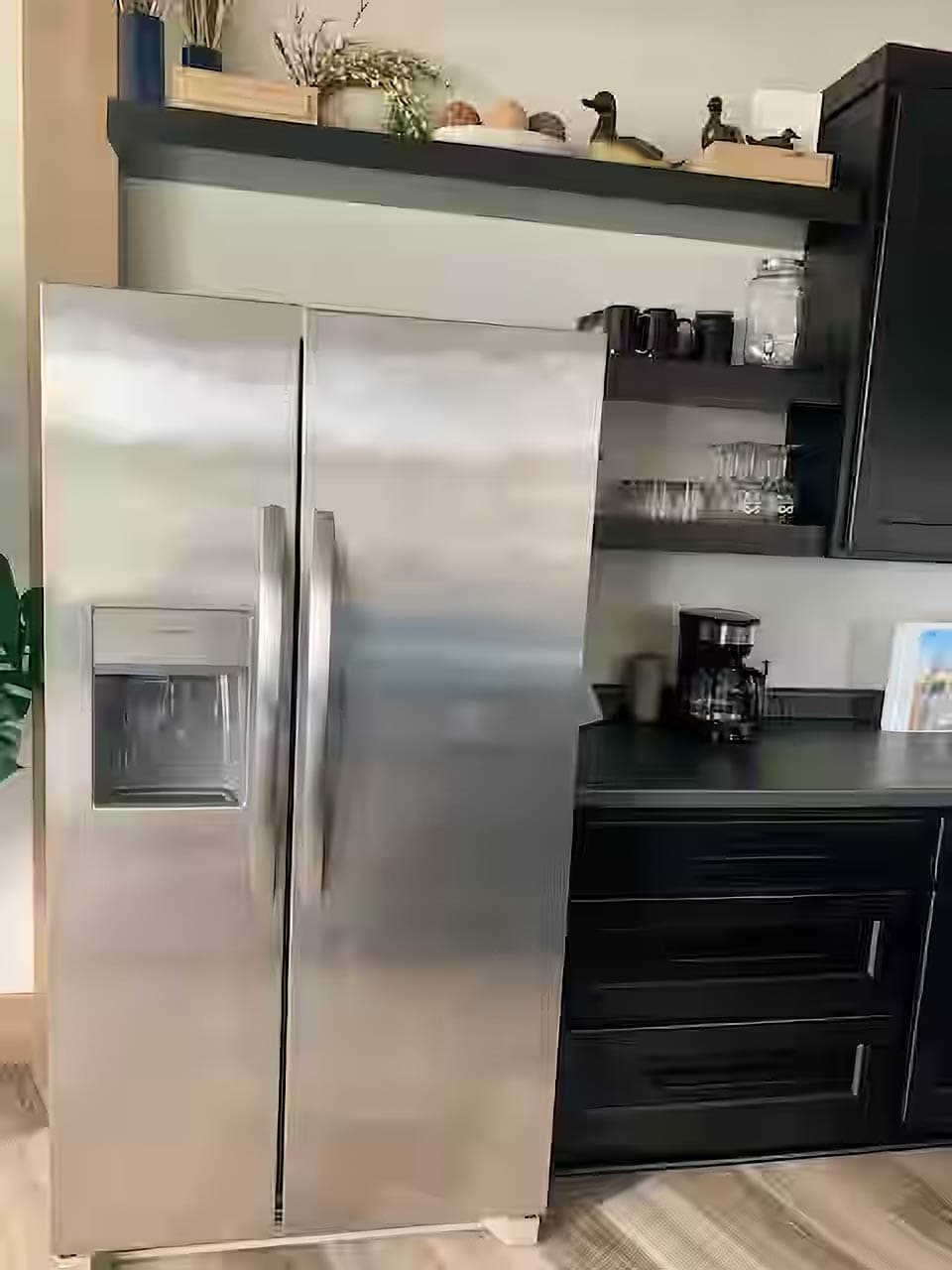 Full fridge and freezer with filtered water and ice machine.