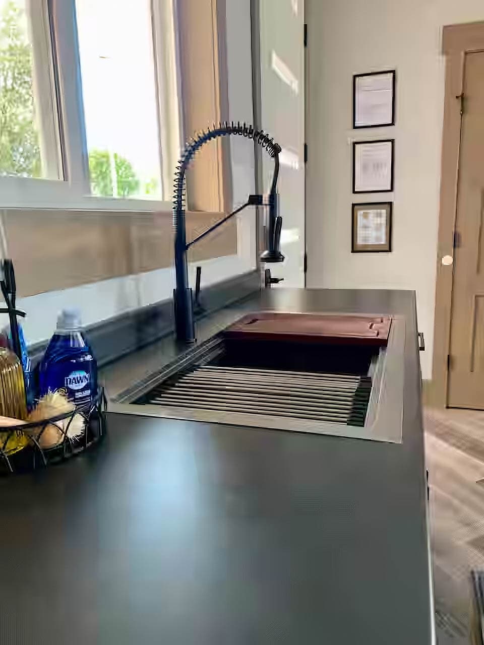 Modern chef's sink with built in workstation.