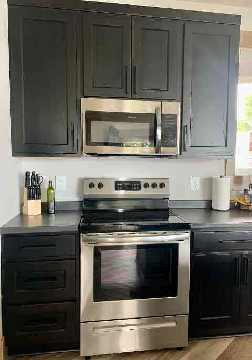Full size stove with fan to vent.