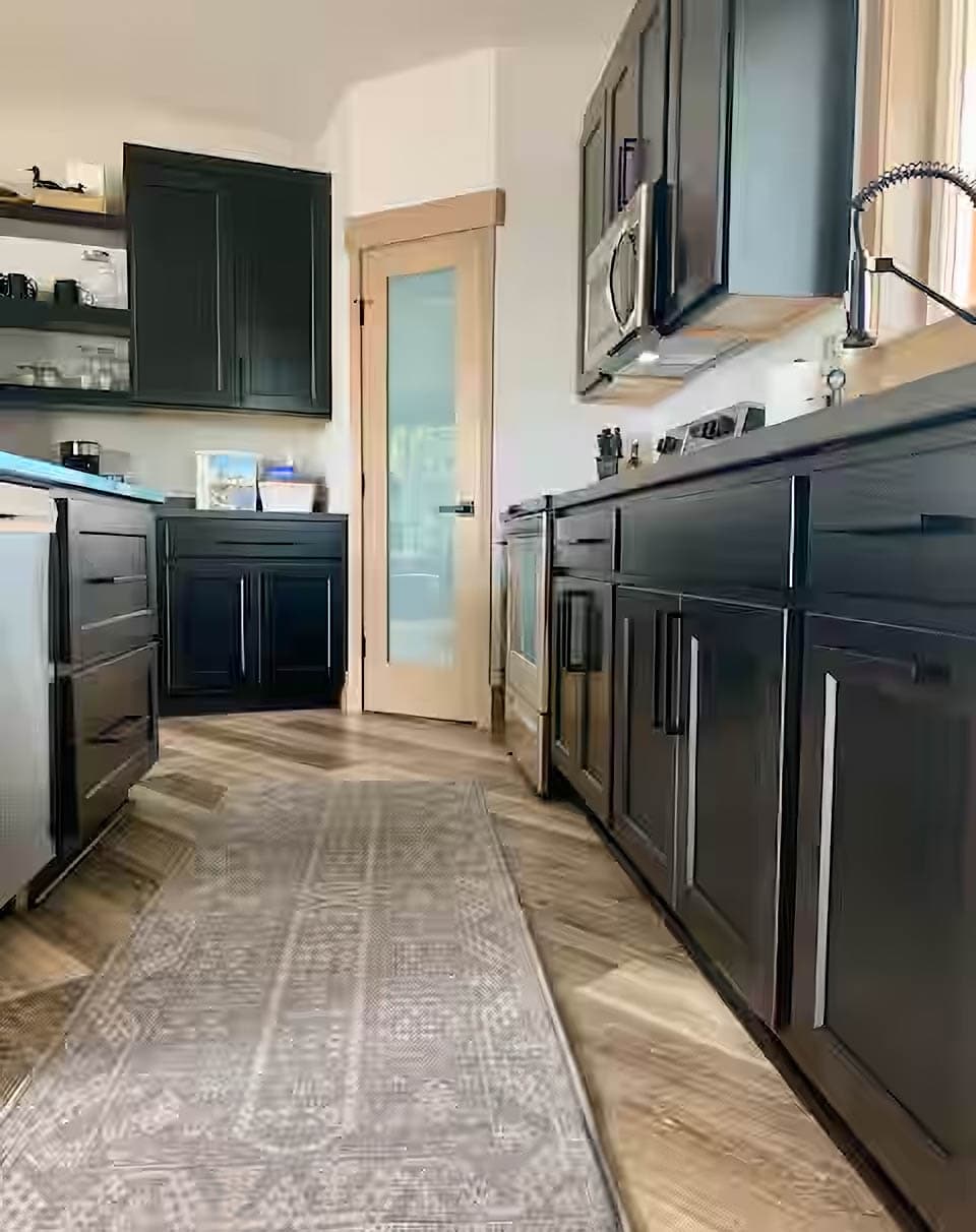 Custom ebony stained hardwood maple cabinets.