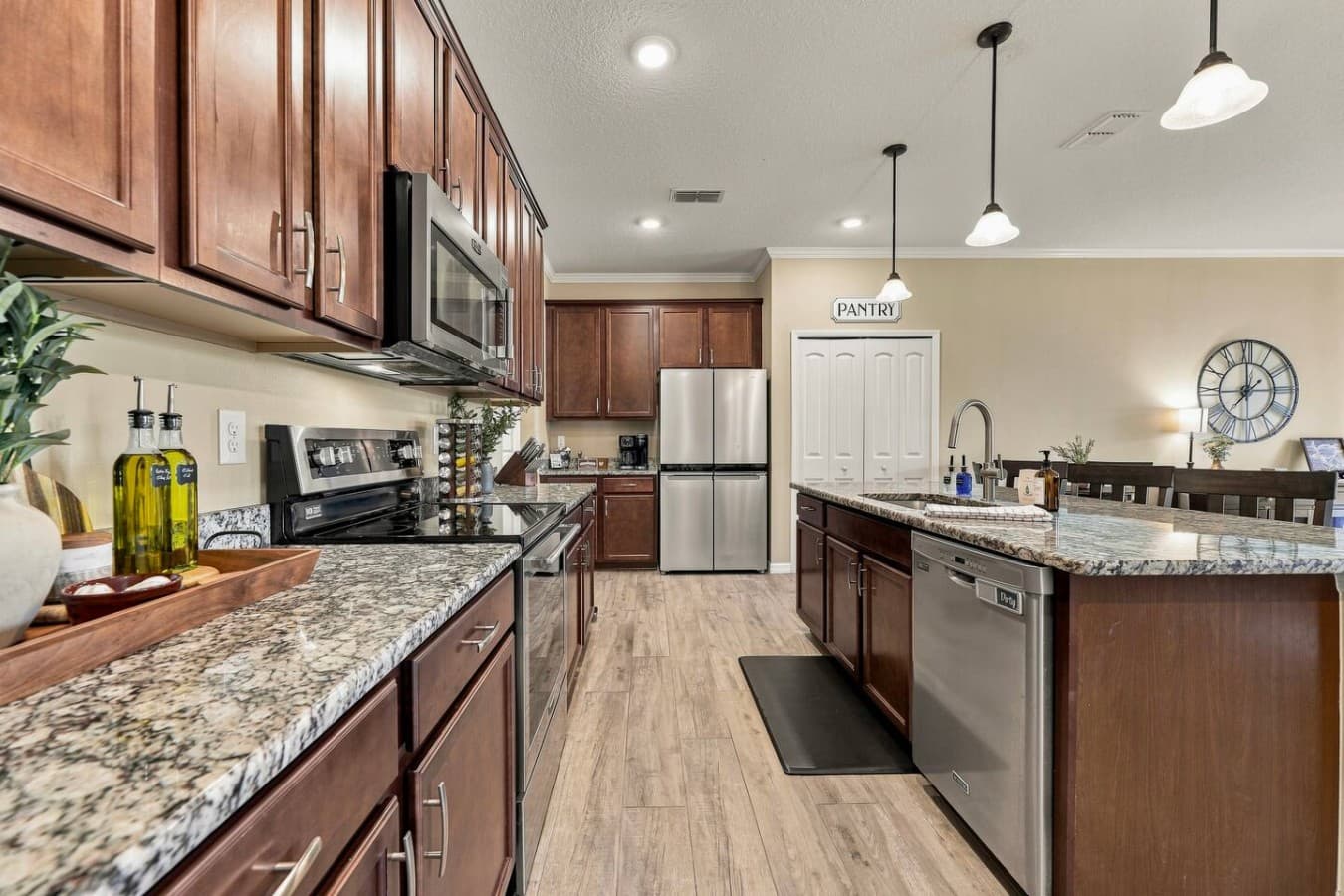 Spacious kitchen with granite countertops, stainless-steel appliances, and plenty of room for preparing meals together