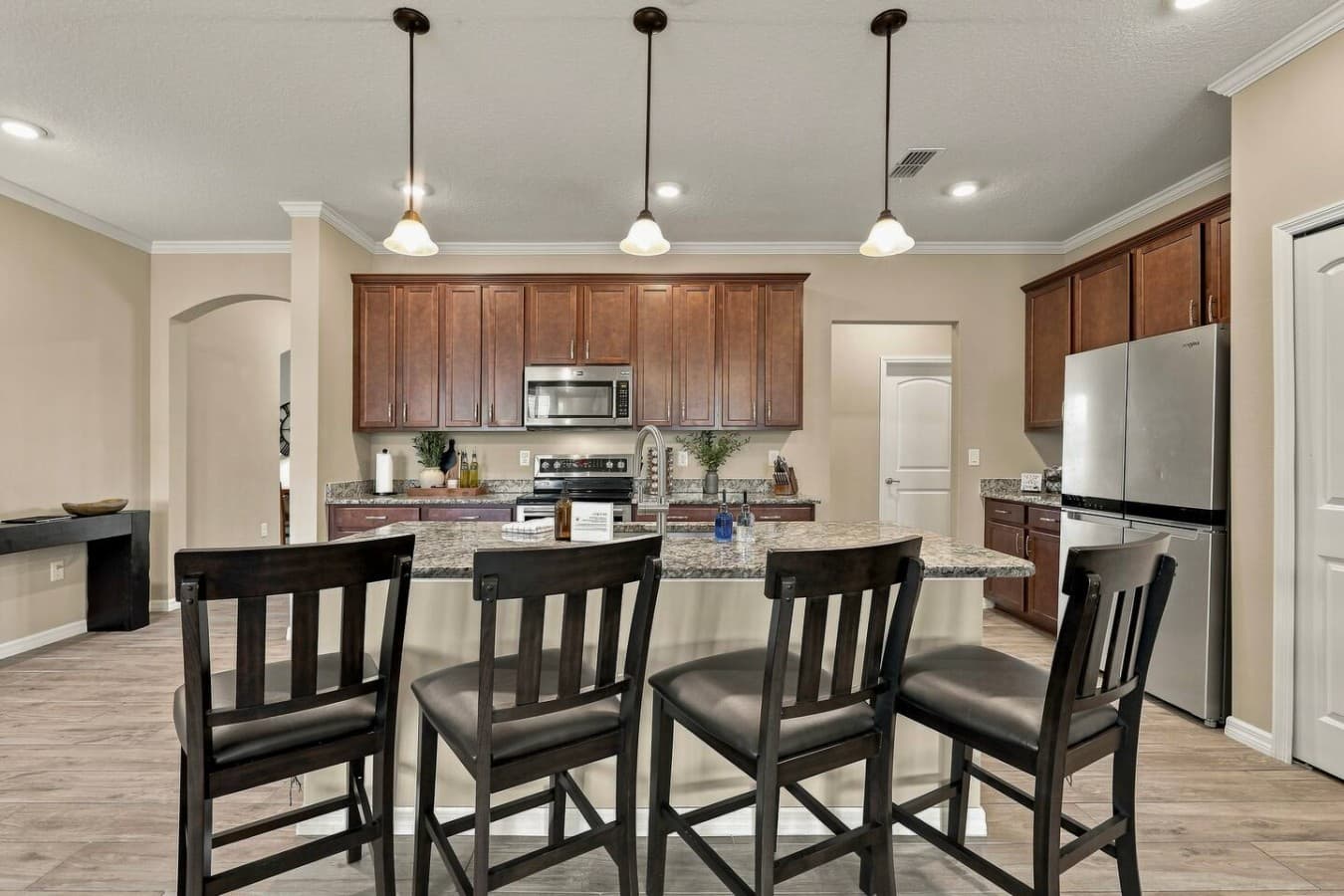 Bright, spacious kitchen with granite counters and a large center island