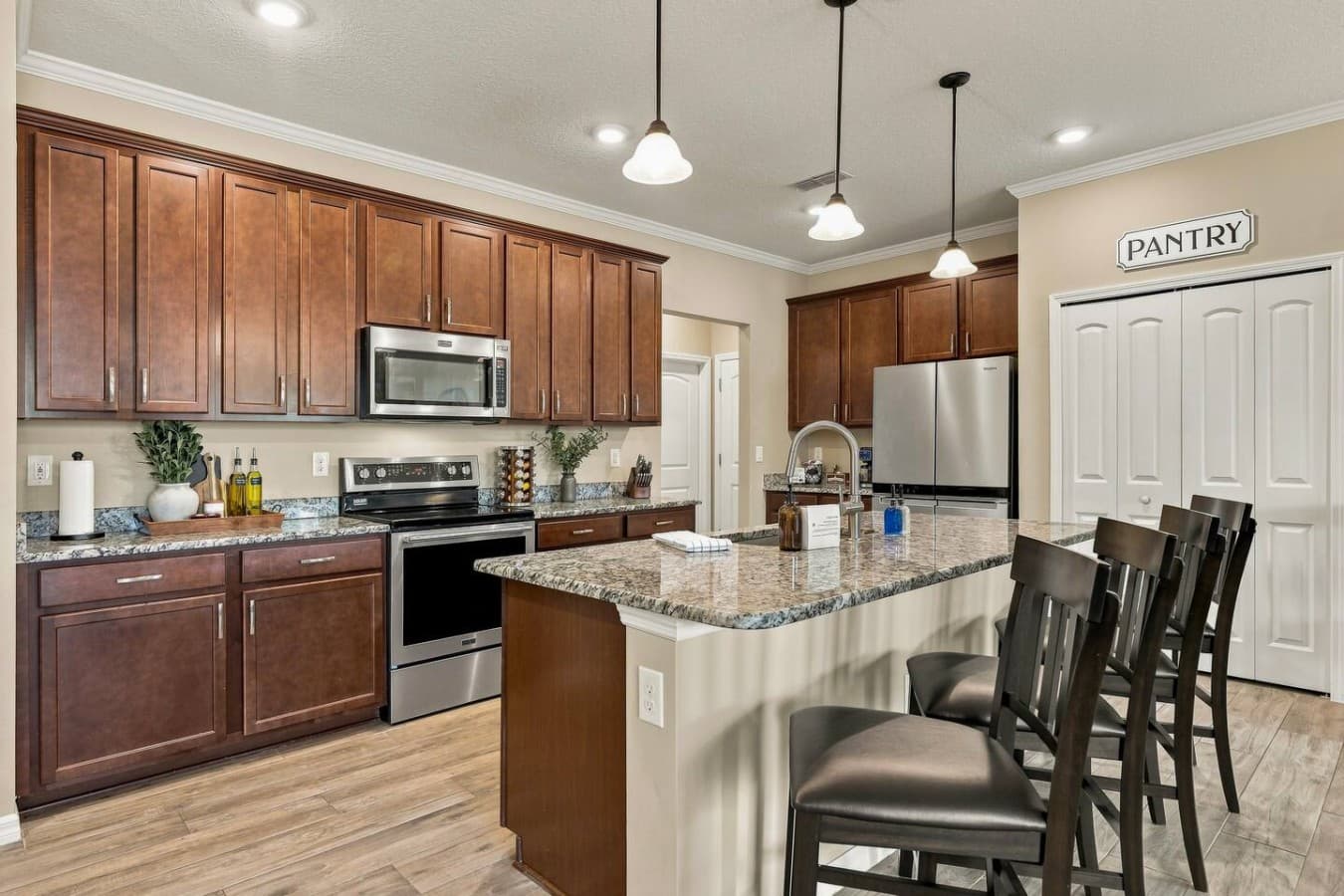 Gather around the spacious kitchen island and enjoy easy access to the dining area
