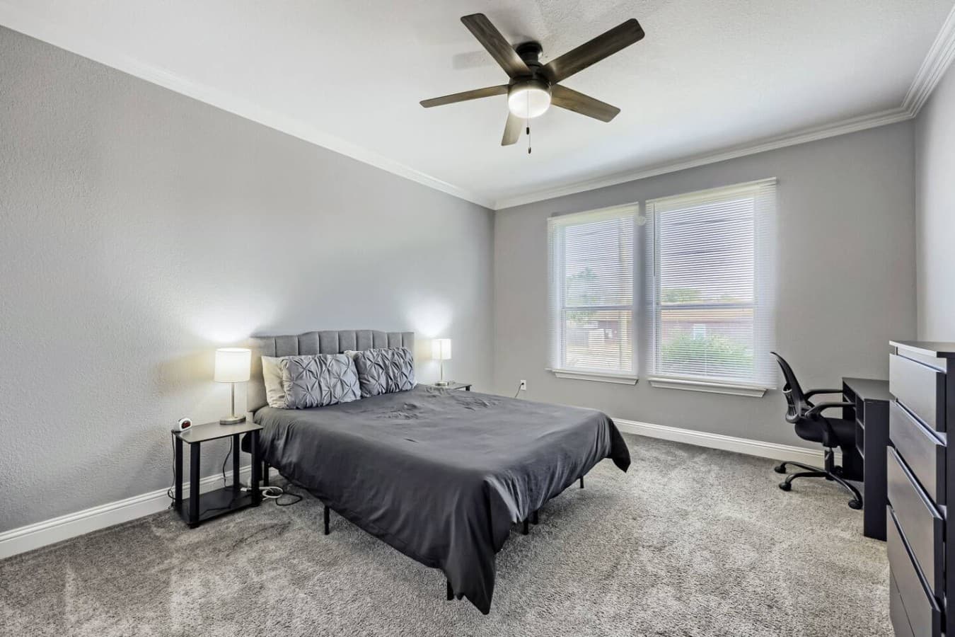Recharge in the queen bed, with a workstation nearby when work calls.