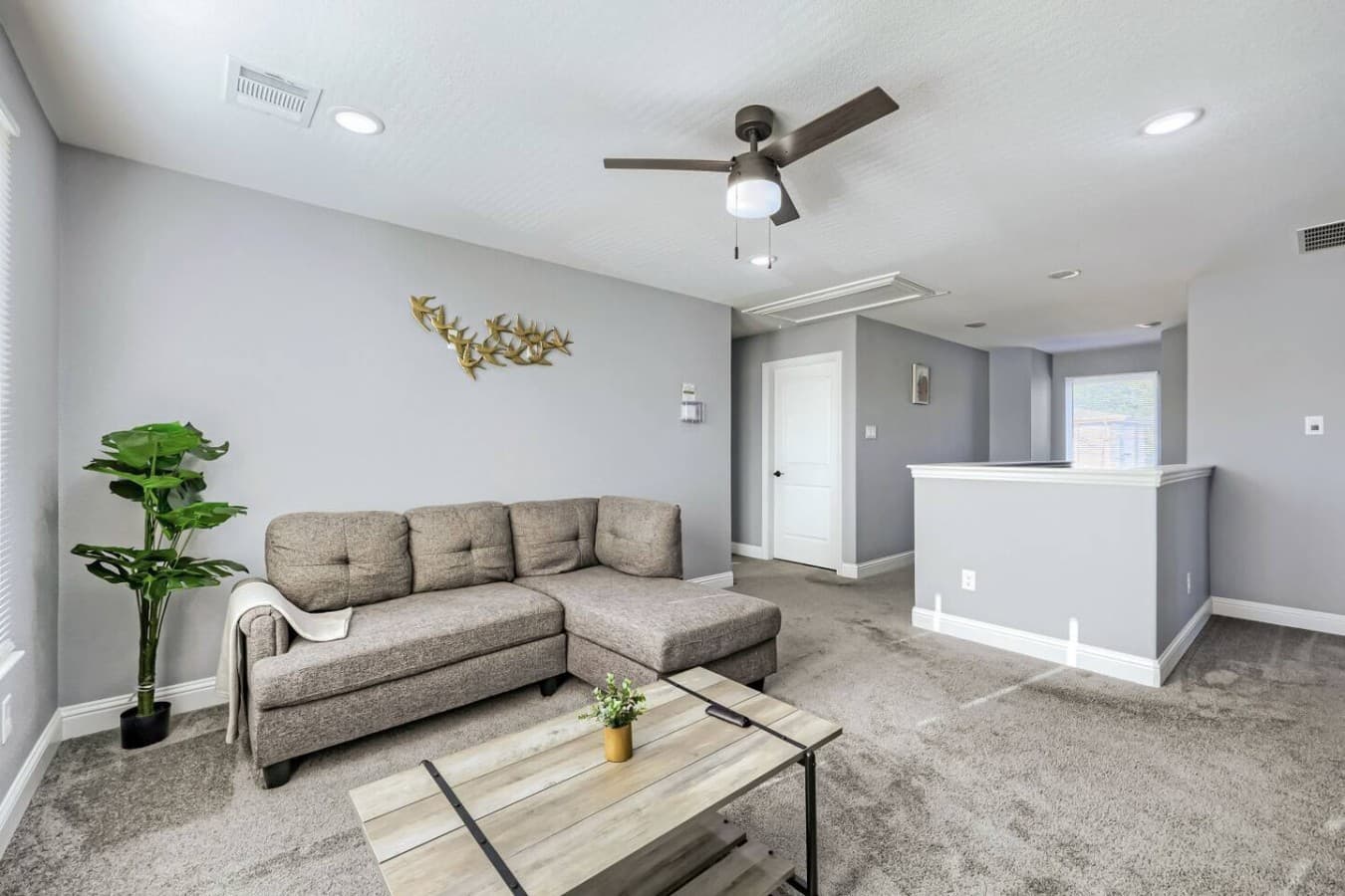 Unwind in the upstairs lounge, featuring a cozy chaise sectional and plenty of space to relax between adventures.
