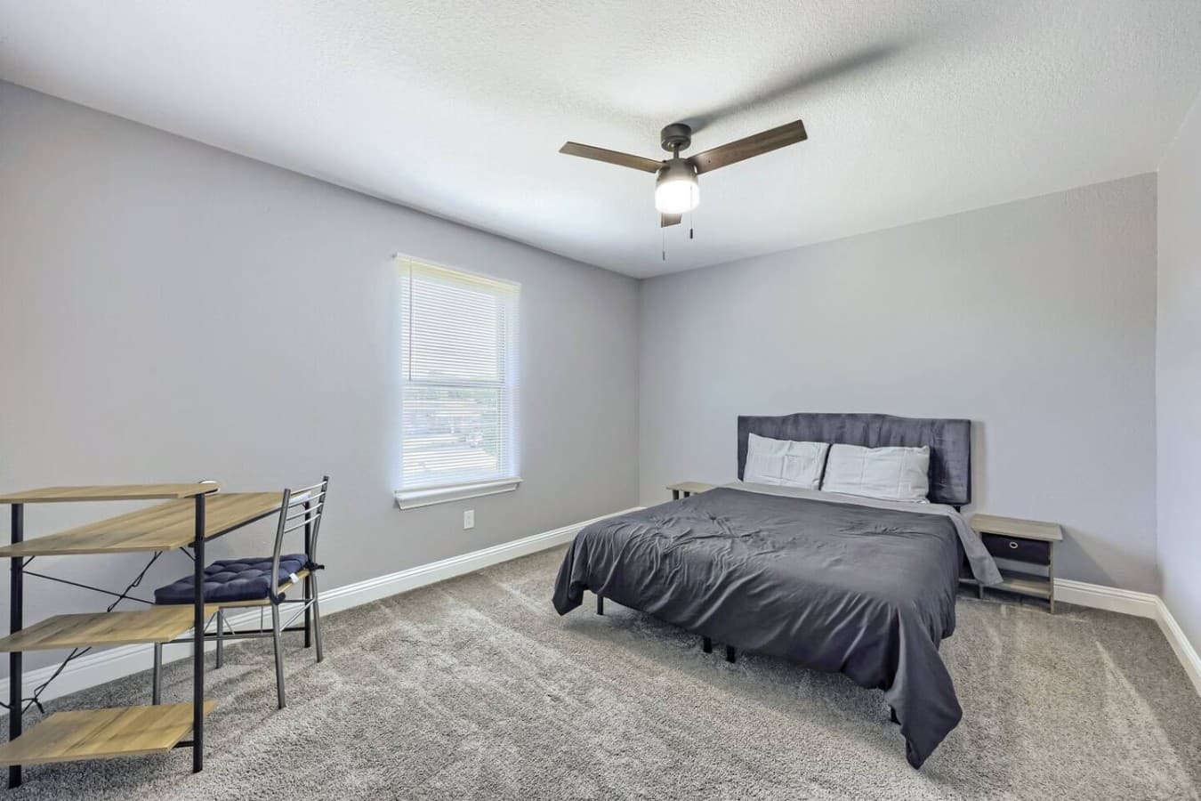 Enjoy the convenience of a queen bed and workspace together in one room.