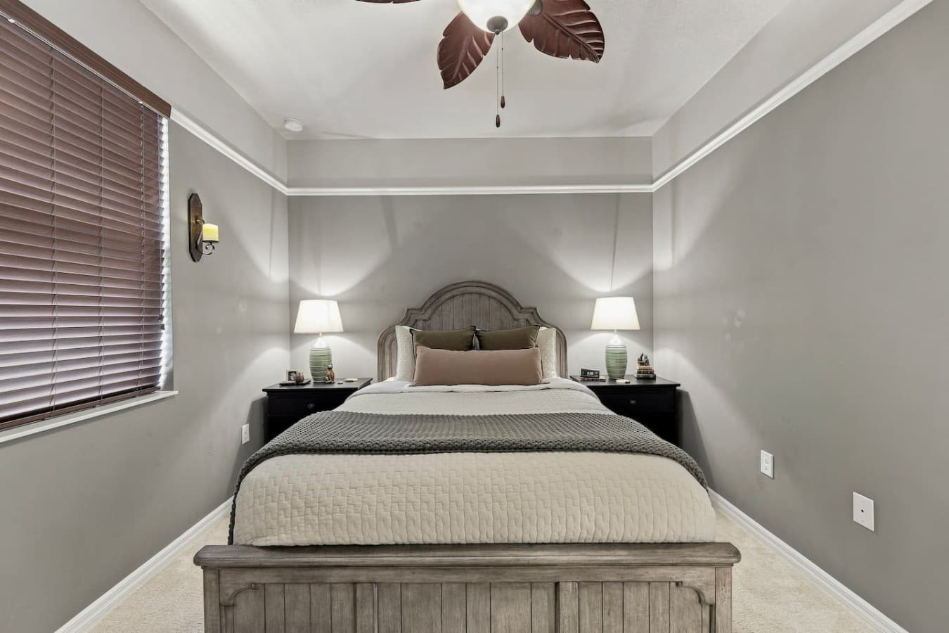 Bedroom one features a comfortable queen-size bed for a restful night’s sleep.
