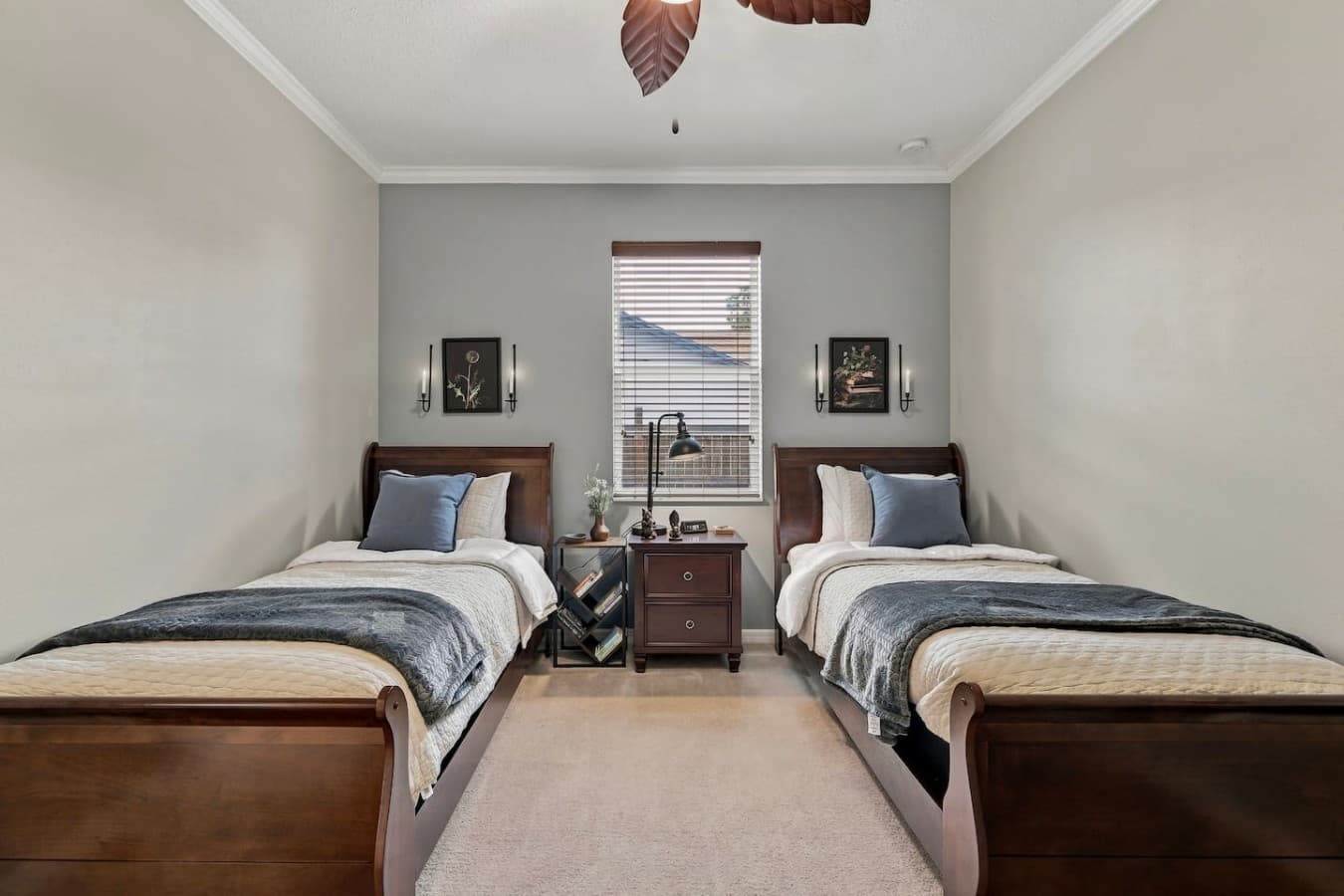 Ideal for siblings or friends, this inviting bedroom offers two comfortable single beds.