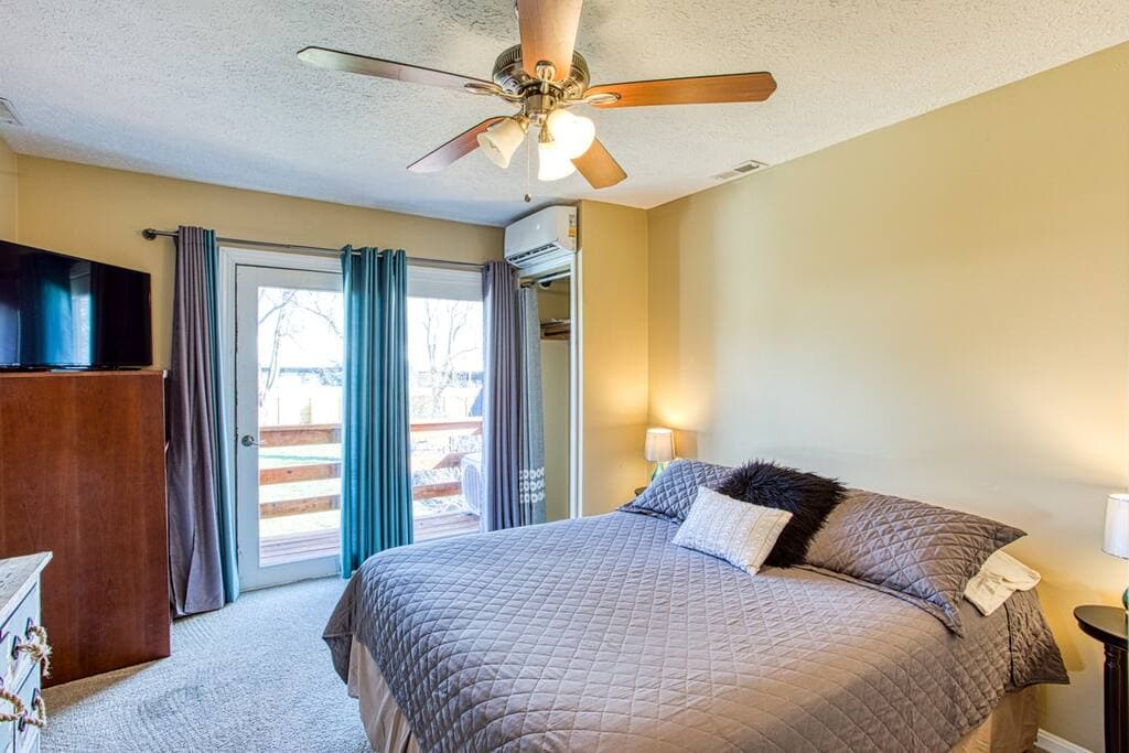 Upstairs, bedroom 3, queen bed, 42 inch TV, mini-split AC with balcony to back yard