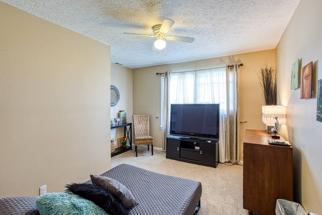 Upstairs, bedroom 4, full size low platform bed, 42 inch TV, window unit AC