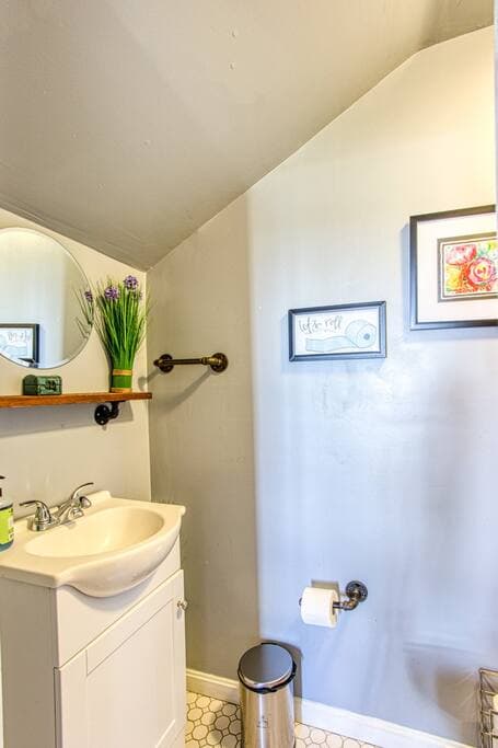 Upstairs bathroom sink and toilet area.  