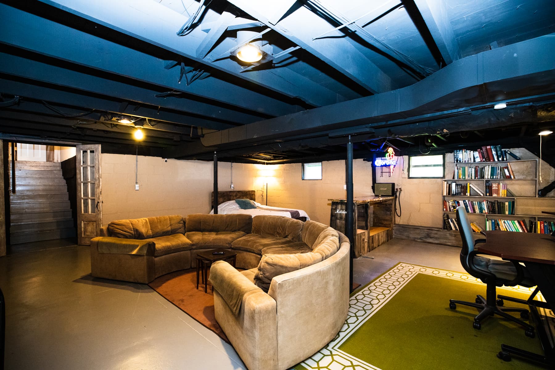 Basement, bedroom 5 + large circular couch and bar area for entertaining