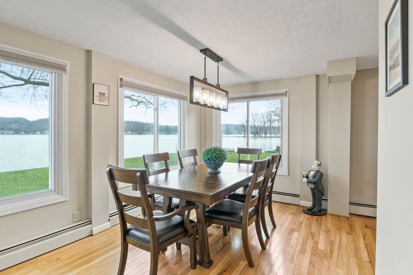 Dining area with large lake-facing windows