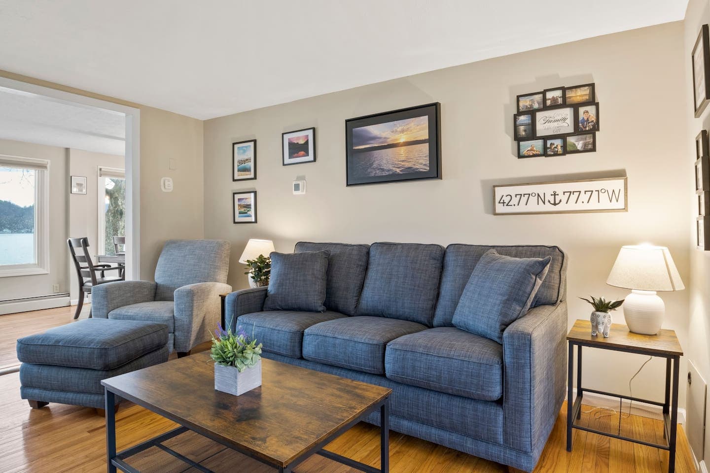 Blue sectional seating with coffee table in the middle 