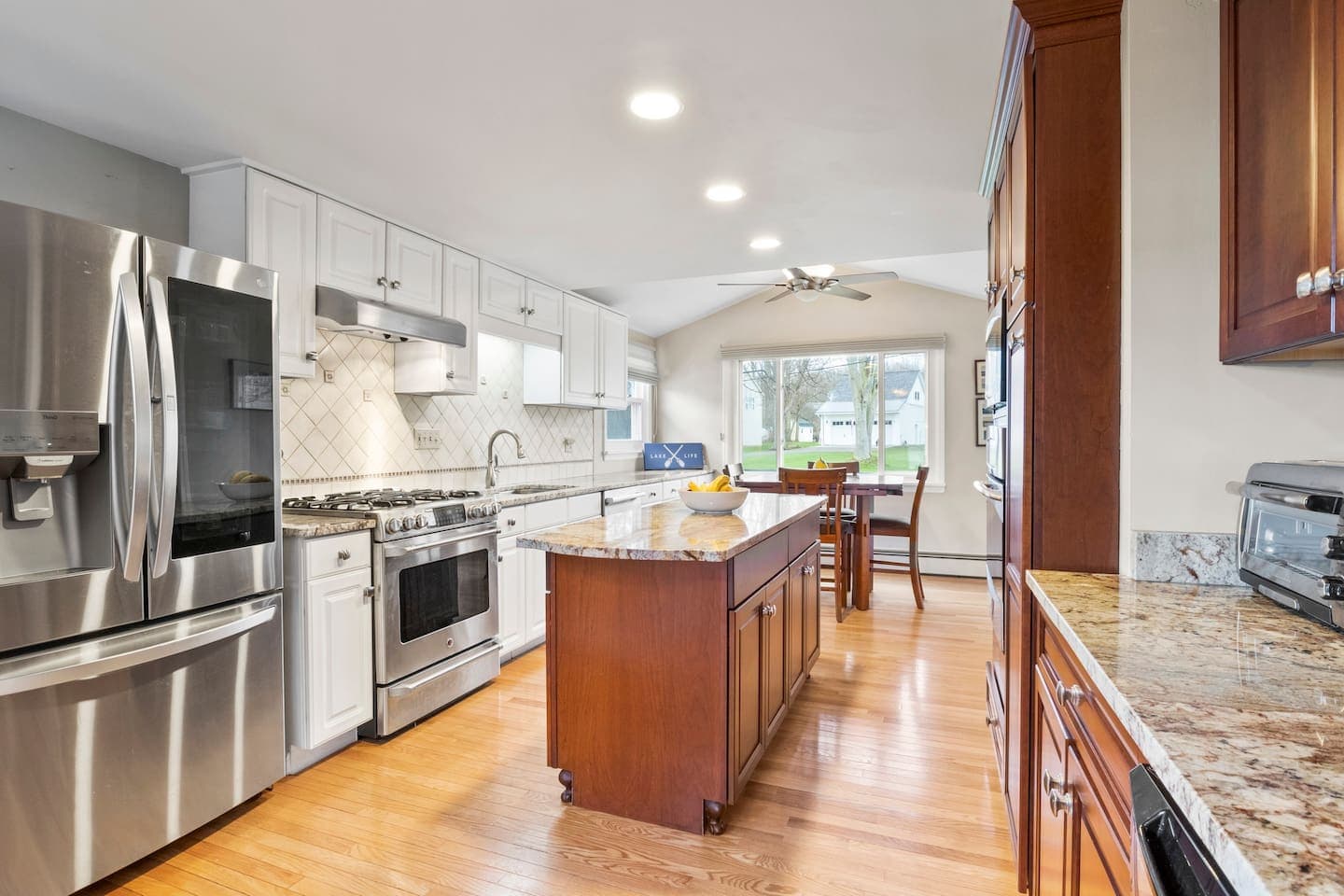 Fully-equipped kitchen with stainless steel appliances and kitchen island