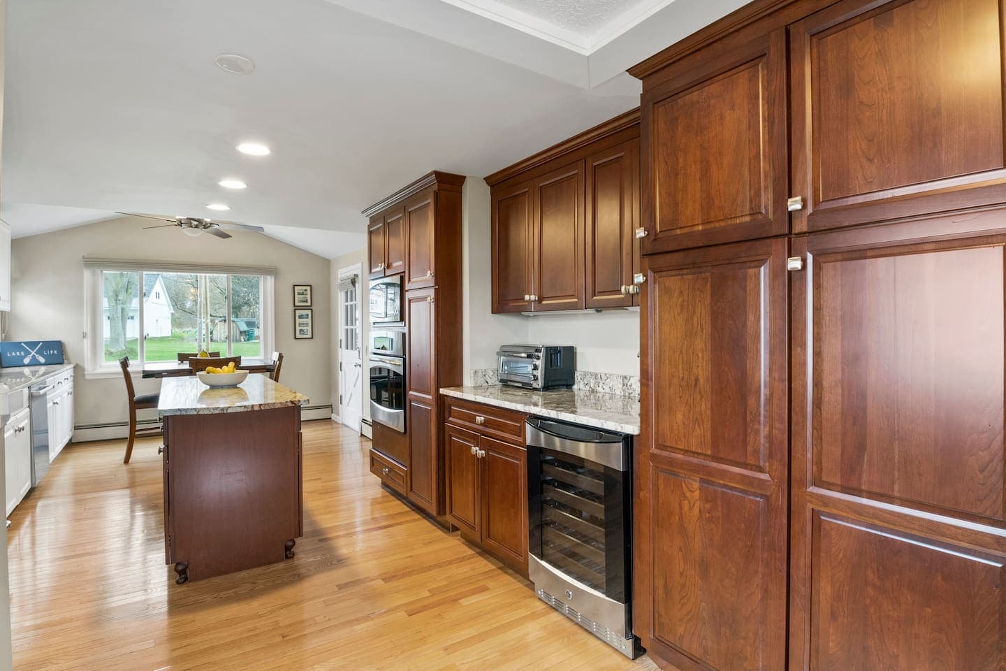 Wood cabinetry surrounding the open kitchen