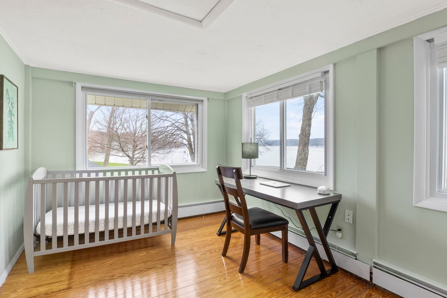 Windowed area with a dedicated workspace and crib