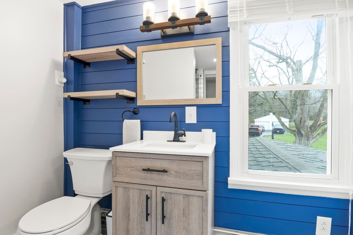 Blue accent bathroom with modern vanity