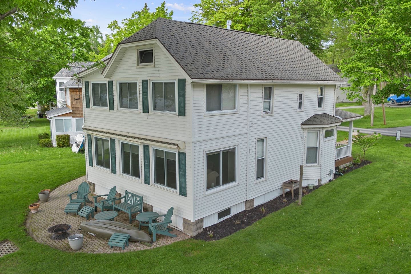 Two-story home with outdoor seating