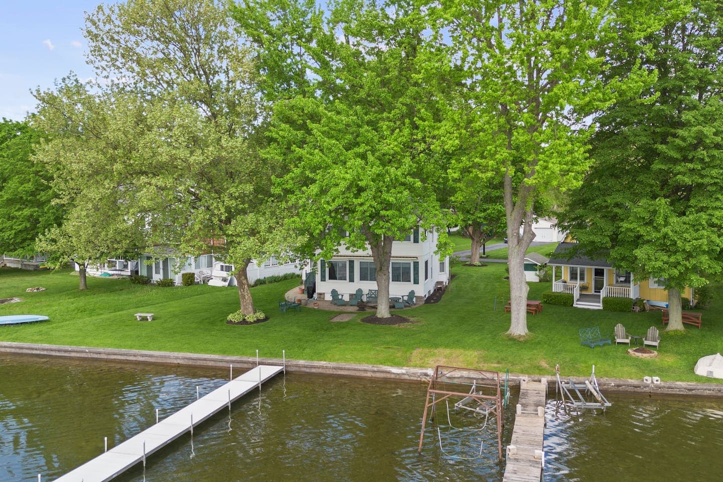 View of the tree-lined property from the lake