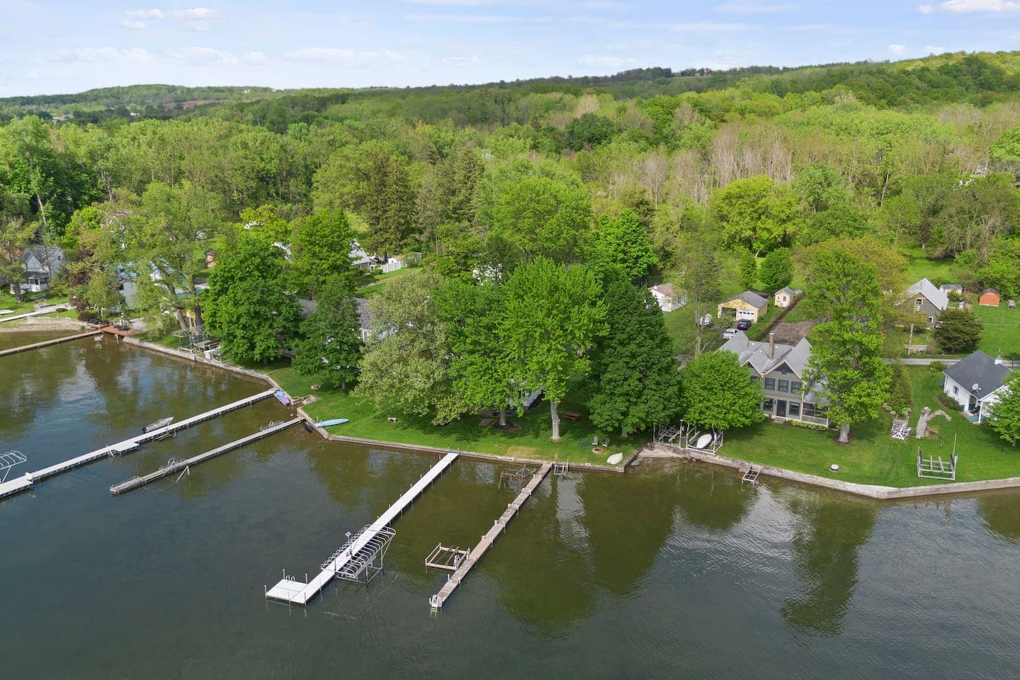 Aerial shoreline view with multiple docks